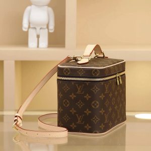 Alternative view of Cosmetic Bag Drawing inspiration from the iconic Nice cosmetic bag, this elegant toiletry case offers a distinctive way to carry essential beauty products. A hidden zippered pocket inside the flap provides secure storage for particularly valuable personal items.- Top woven handle - Monogram-coated canvas - Specially coated canvas washable lining - Natural cowhide leather trim - Gold-tone metal hardware - Double zipper closure - Generous interior capacity - Zipper pocket inside flap - Multiple interior slip pockets - Size: 24*14*17 cm